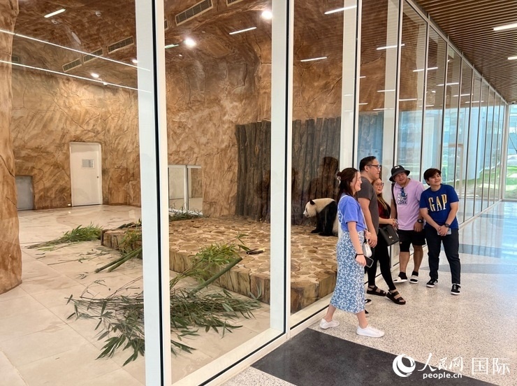 當(dāng)?shù)赜慰团c“四?！焙嫌?。人民網(wǎng)記者 張志文攝